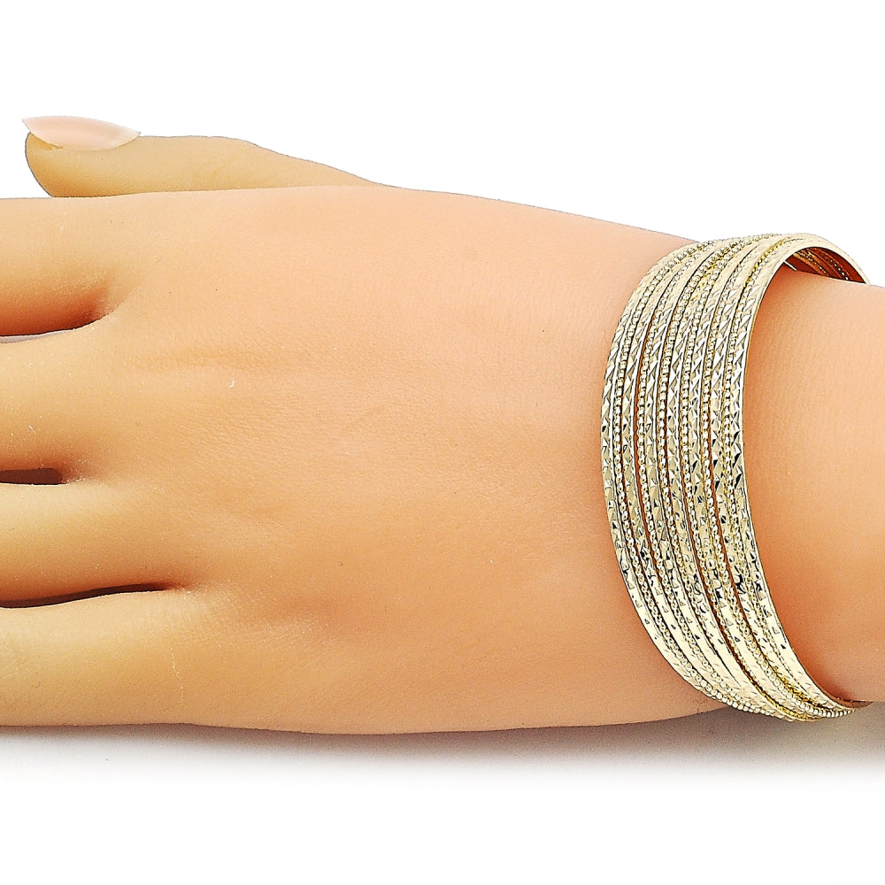 Oro Laminado Individual Bangle, Gold Filled Style Twist Design, Diamond Cutting Finish, Golden Finish