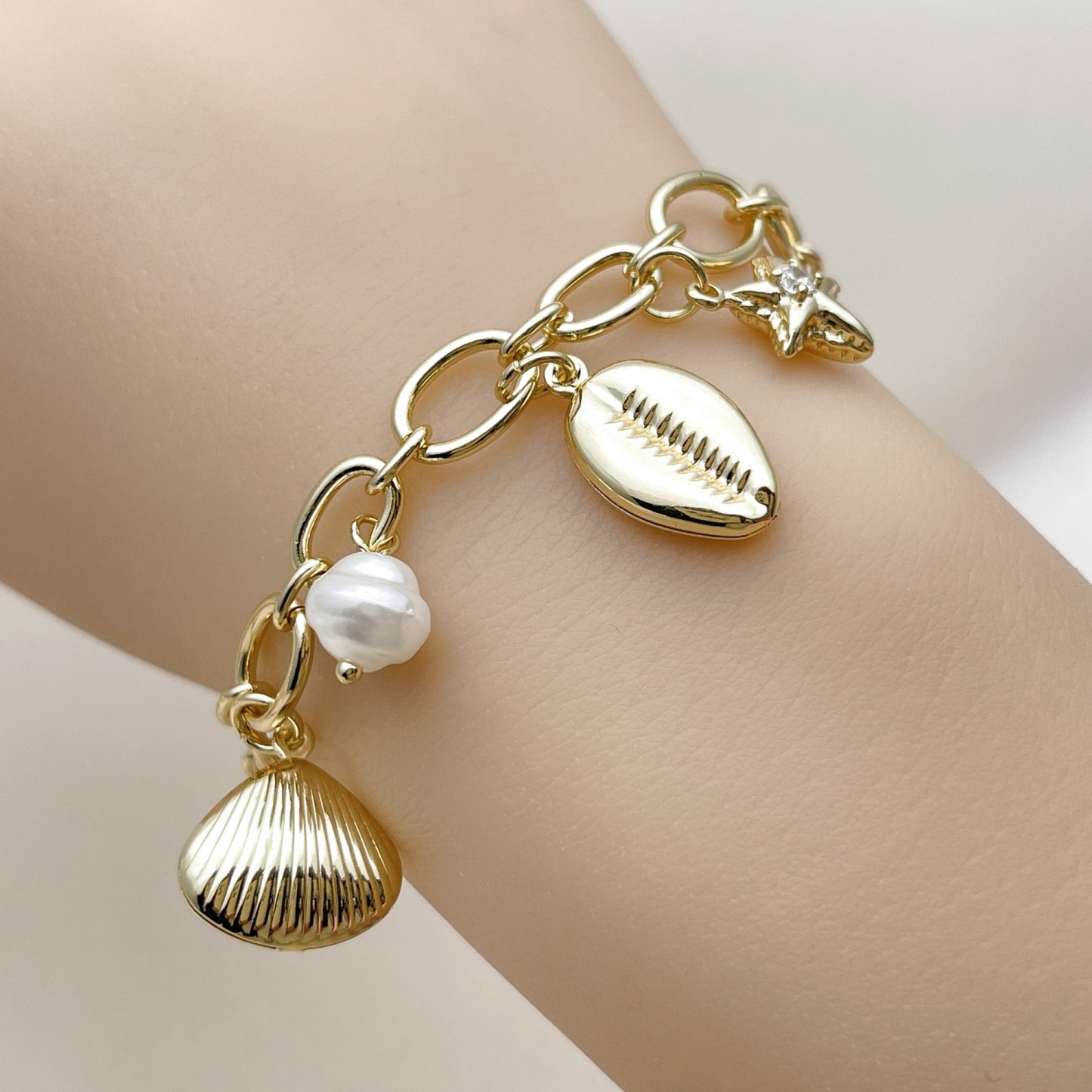 Oro Laminado Charm Bracelet, Gold Filled Style Shell and Star Design, with Ivory Pearl and White Cubic Zirconia, Polished, Golden Finish