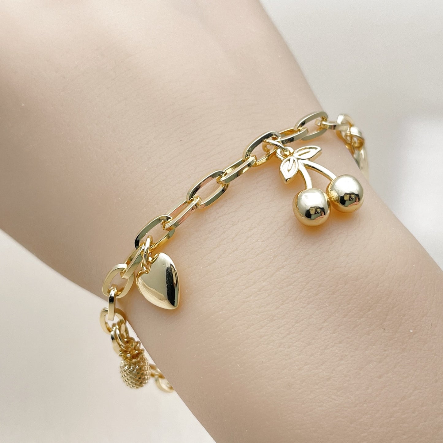 Oro Laminado Charm Bracelet, Gold Filled Style Cherry and Heart Design, Polished, Golden