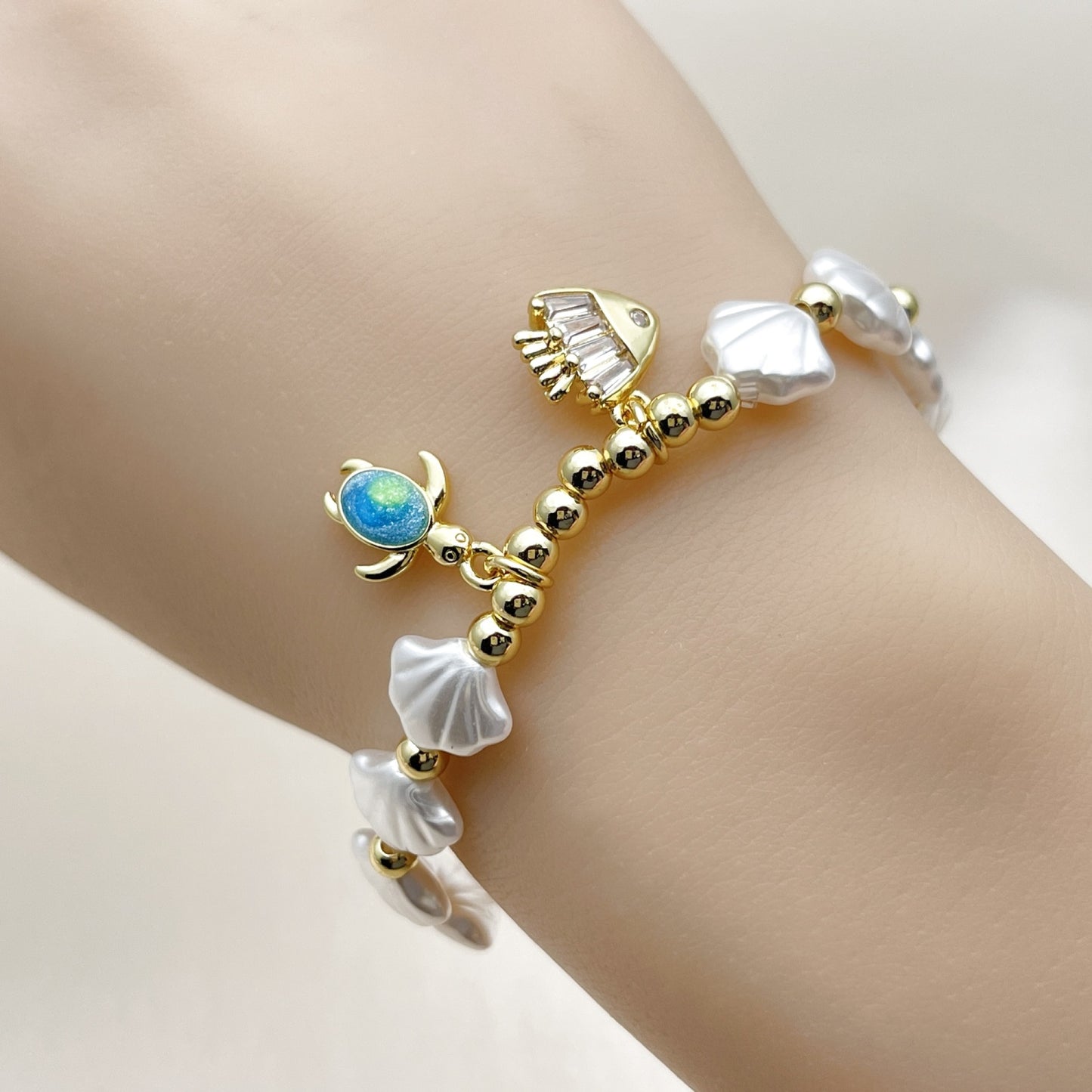 Oro Laminado Fancy Bracelet, Gold Filled Style Shell and Turtle Design, with Ivory Pearl and White Cubic Zirconia, Polished, Golden