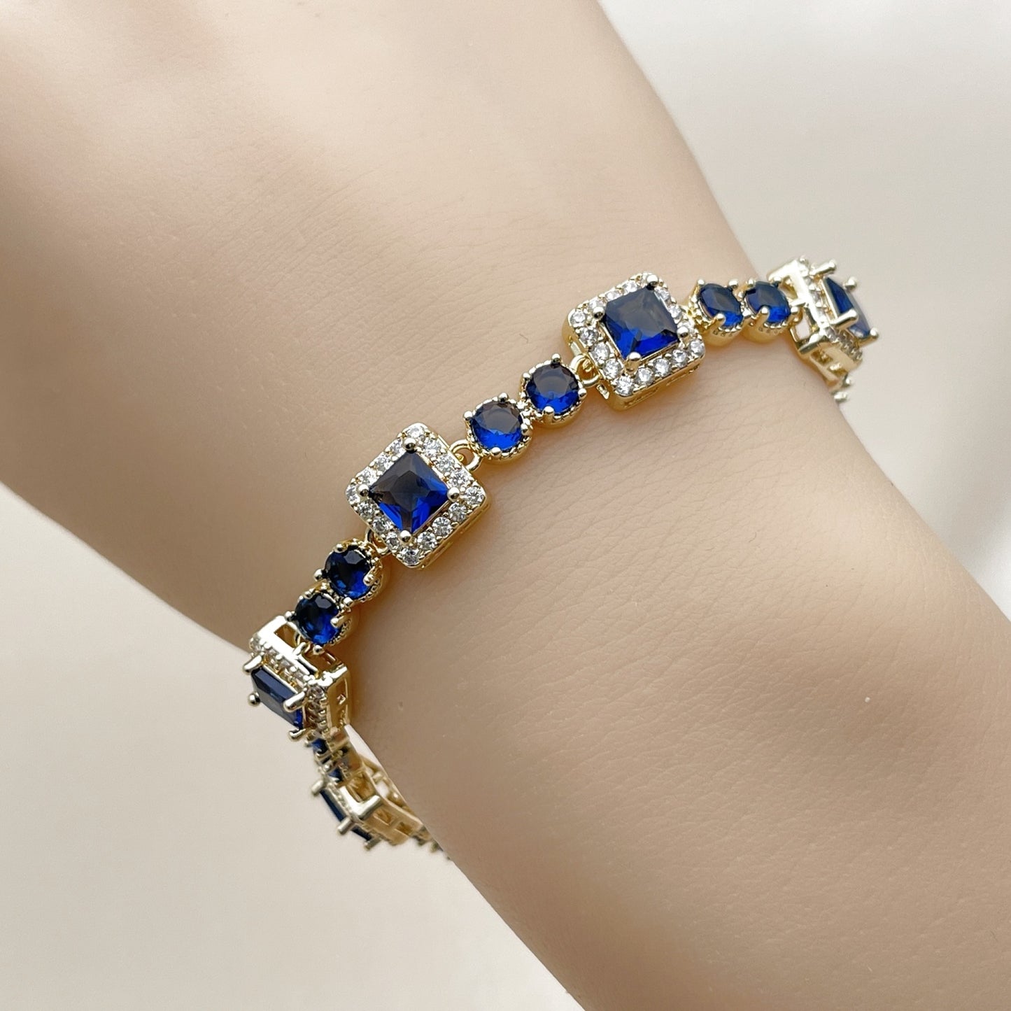 Oro Laminado Tennis Bracelet, Gold Filled Style Cluster Design, with Sapphire Blue and White Cubic Zirconia, Polished, Golden Finish